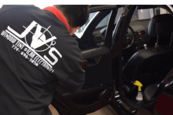 technician installing car speakers technician installing car speakers